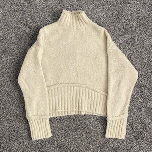 Cream Knit stitch and feather sweater